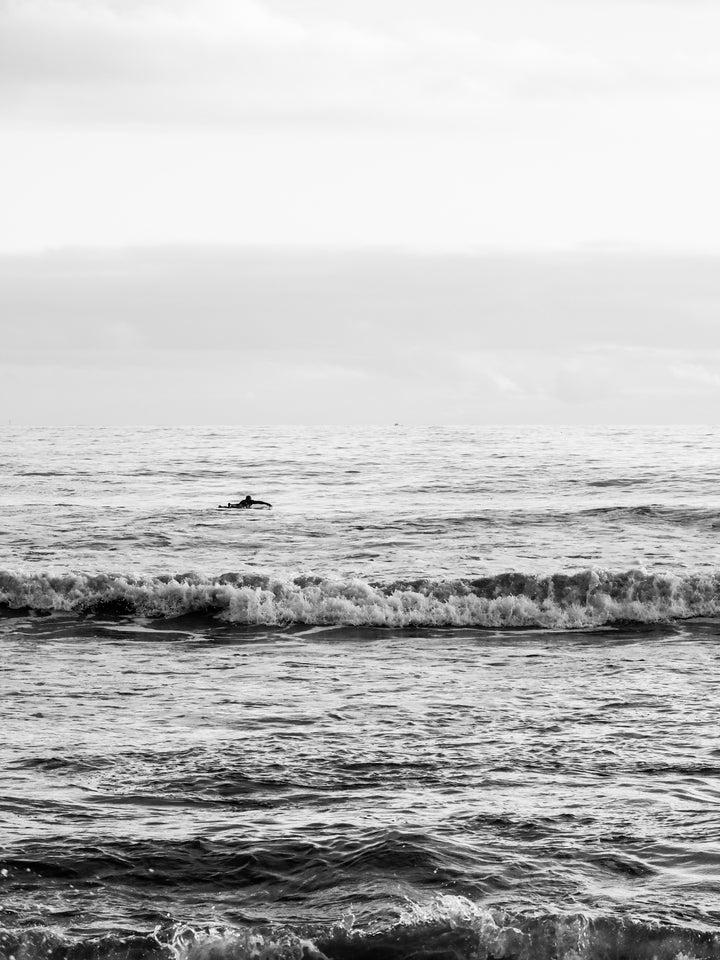 A lone surfer Newquay Cornwall in black and white Photo Print - Canvas - Framed Photo Print - Hampshire Prints