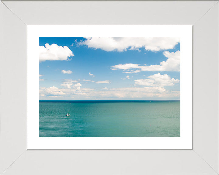 A calm Cornwall coastline with sailing boat Photo Print - Canvas - Framed Photo Print - Hampshire Prints