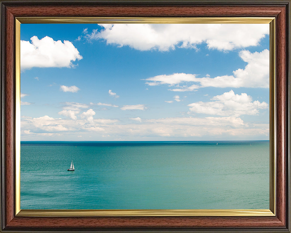 A calm Cornwall coastline with sailing boat Photo Print - Canvas - Framed Photo Print - Hampshire Prints